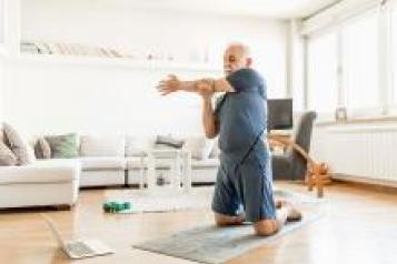 Man exercising online at home