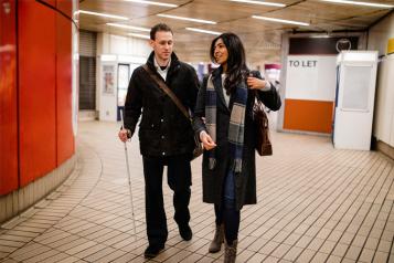 Blind man with woman